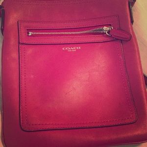 Coach fuchsia colored cross-body purse